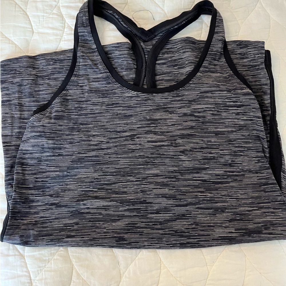 4 Lululemon tank tops and 3 short sleeve tops! All size 12.